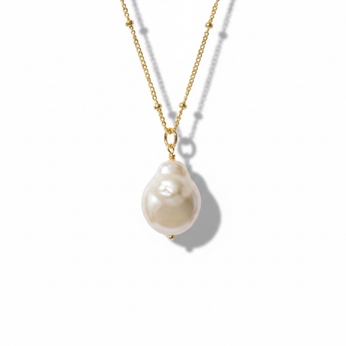 Baroque Pearl Pendant Necklace — White Background Editorial