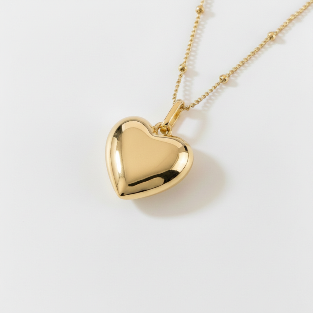 Gold Heart Necklace on White Background
