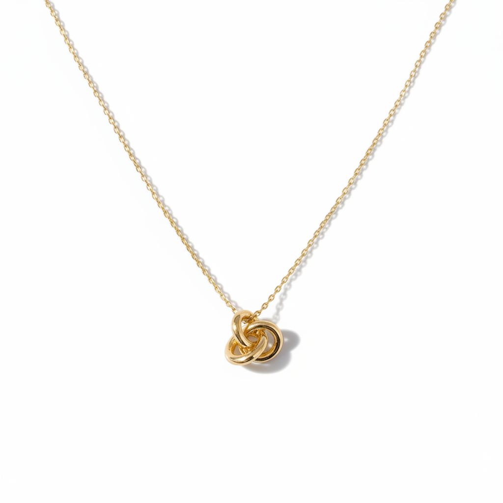 Gold Knot Necklace Flat Lay on White