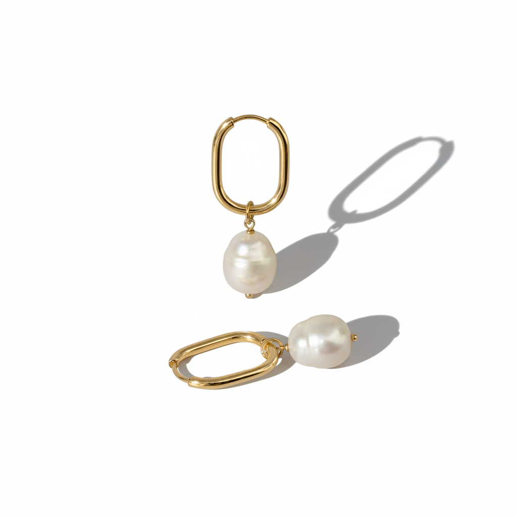 Gold Oval Hoop Pearl Earrings on White Background