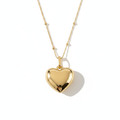 Gold Puffed Heart Pendant — Editorial Shadow on White